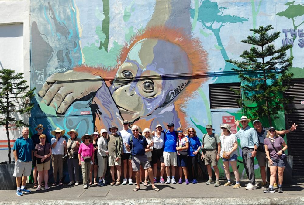 Here's our friends in front of a wall, Mural in Sandakan