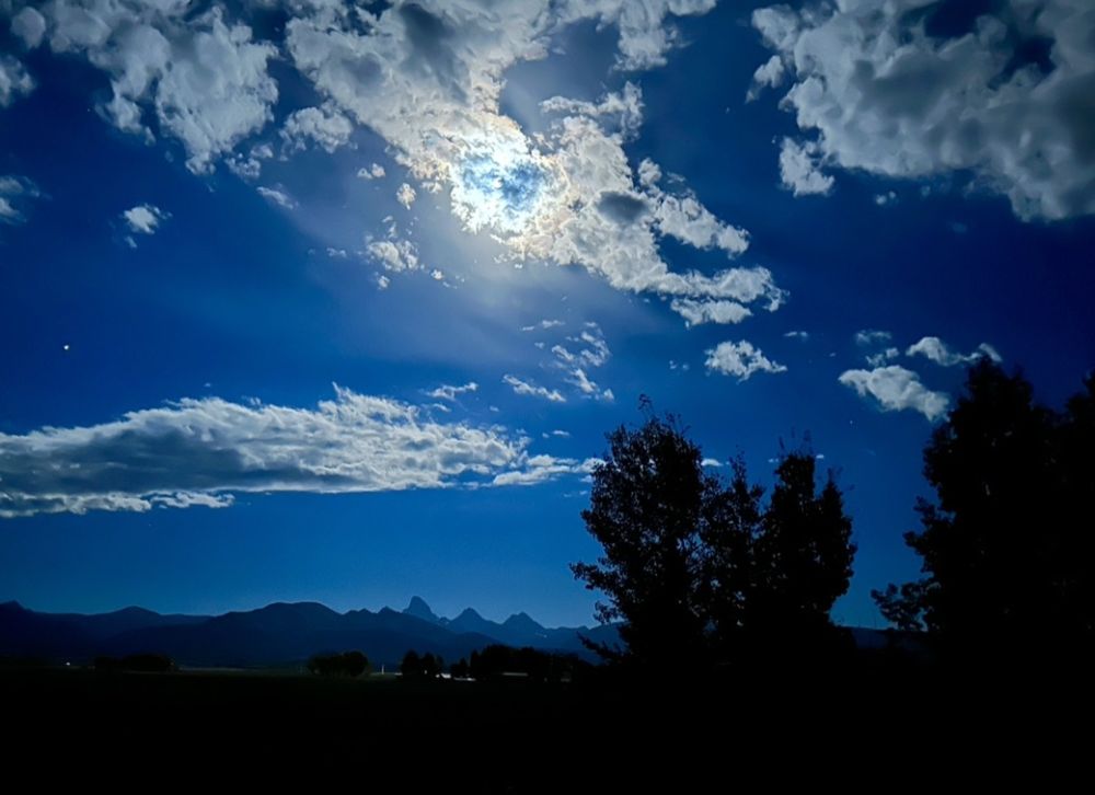 It's hard to see, but this is the view of the moon rising over the Tetons from our hot tub at night.
