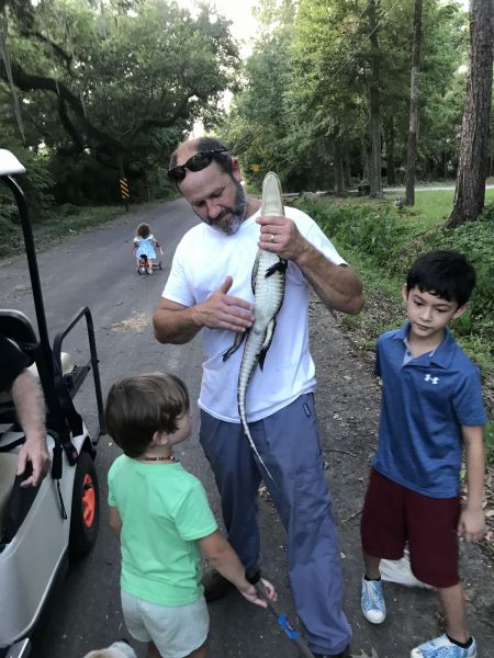 Our neighbor caught this alligator in the ditch outside his home – much to the delight of his children